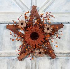 BURLAP SUNFLOWER WITH DAISIES AND MIXED BERRIES ON A WOODEN 