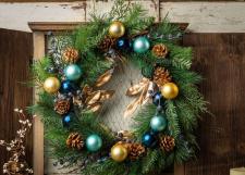 ORNAMENT WREATH WITH BLUE BERRIES, GOLDEN PINE CONES AND GOL